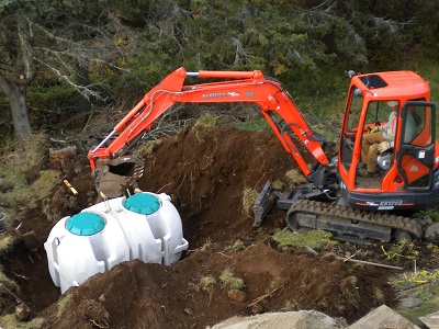 Backhoe digging and septic tanks